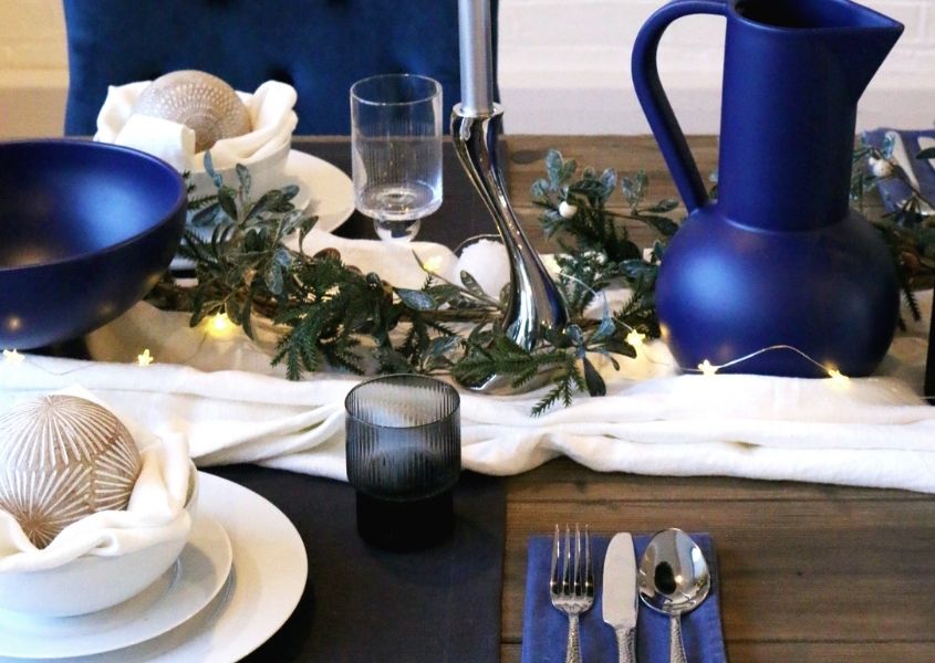 reclaimed wood dining table with blue Christmas decorations