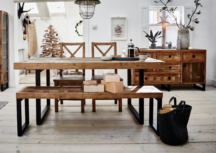 industrial dining table in reclaimed wood with wooden sideboard and Christmas tree