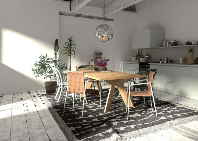 Bright kitchen diner with wooden dining table, chairs and dark rug