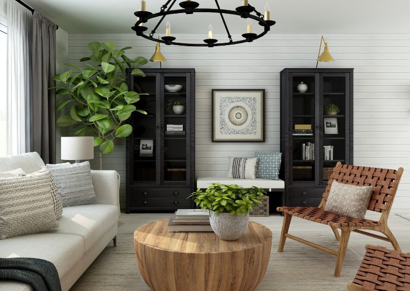 living room with large round wooden coffee table and black display cabinets