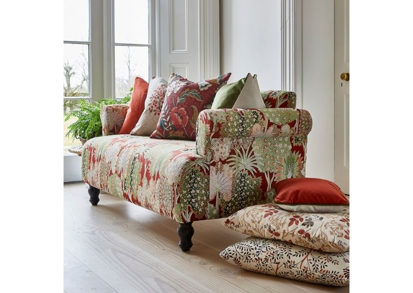 Orange patterned fabric sofa with matching cushions