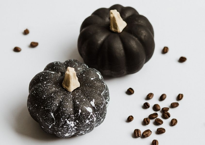 black painted small squashes with coffee beans for easy ways to elevate your halloween decorations