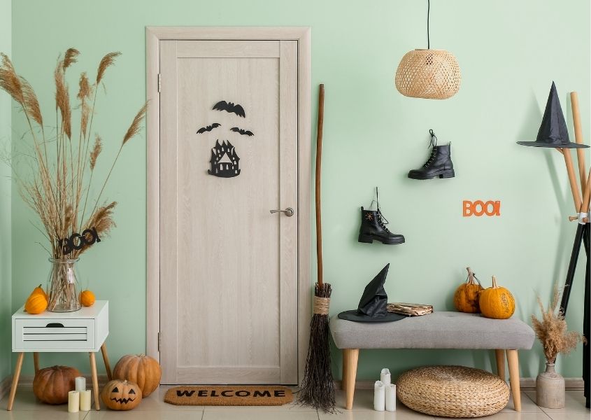 halloween decorations black witches hat on hallway bench