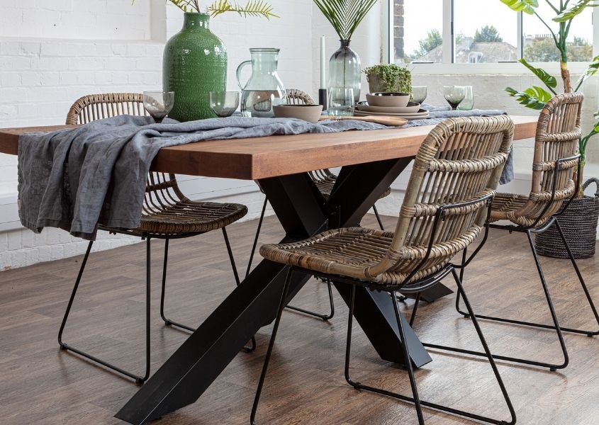 spider leg oak dining table with bamboo chairs