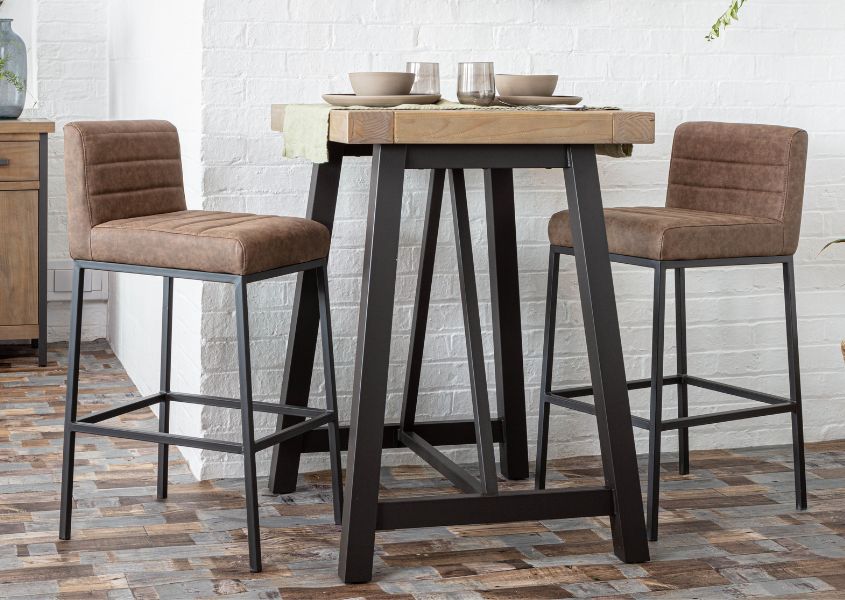 wooden bar table with faux leather bar stools