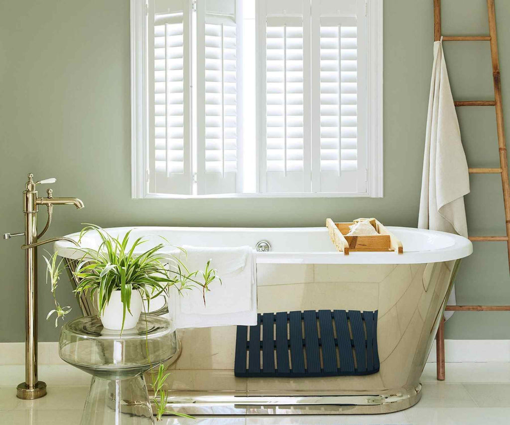 Metal roll top bath tub with white shutters