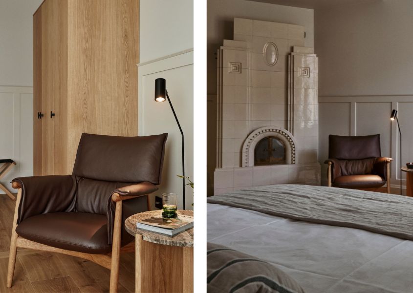 leather armchair and stone fireplace in bedroom of Runo hotel