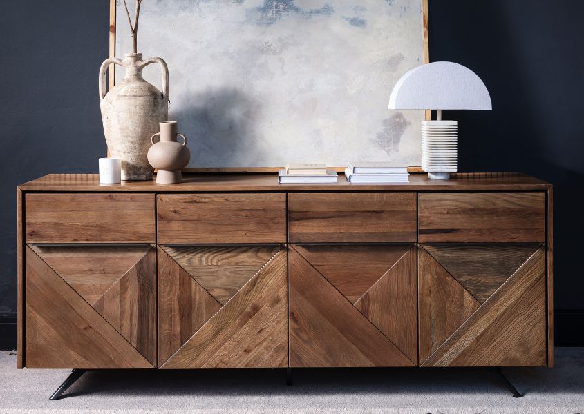 rustic oak sideboard with four cupboards and metal handles