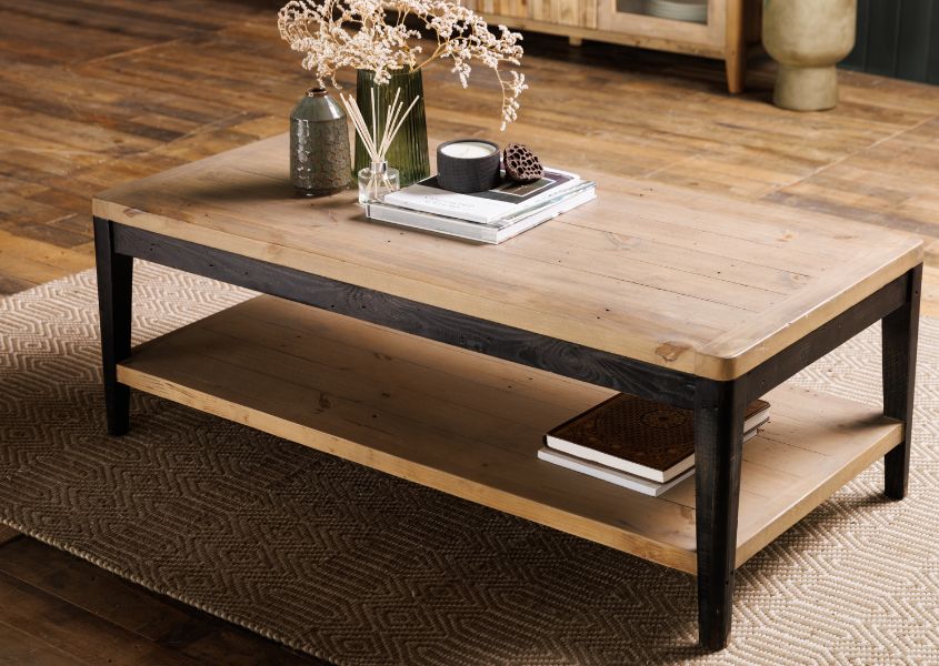 rustic coffee table in reclaimed wood with black painted legs and bottom shelf