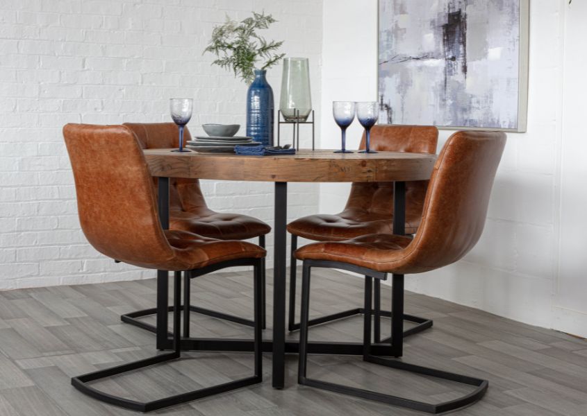 small round dining table with leather dining chairs