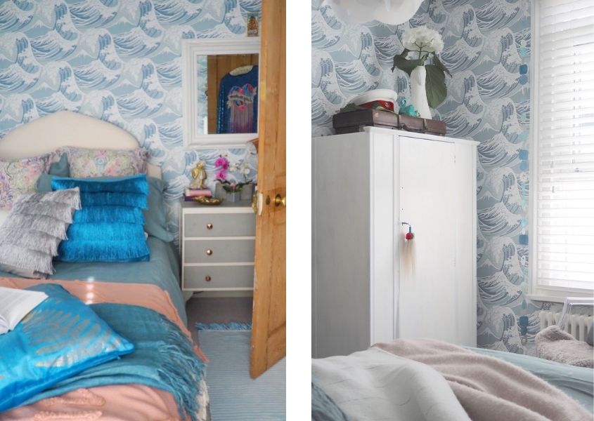 blue patterned wallpaper in bedroom with white wooden wardrobe and blue and pink covers