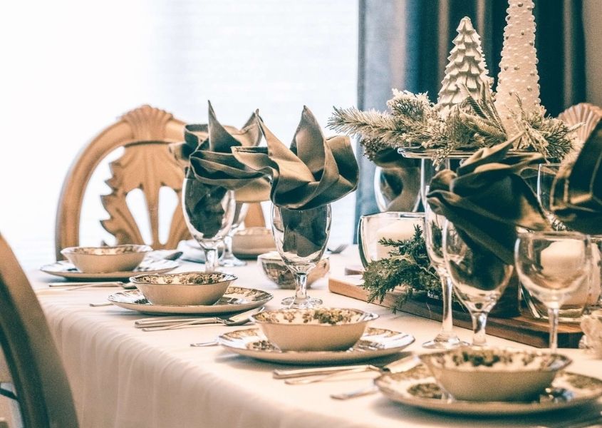 wooden dining table decorated for Christmas