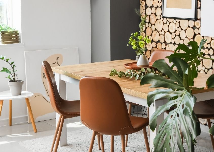 wooden dining table with brown leather dining chairs