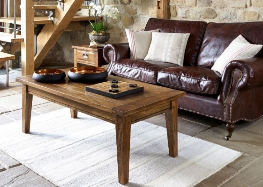 mango wood coffee table with dark brown leather sofa