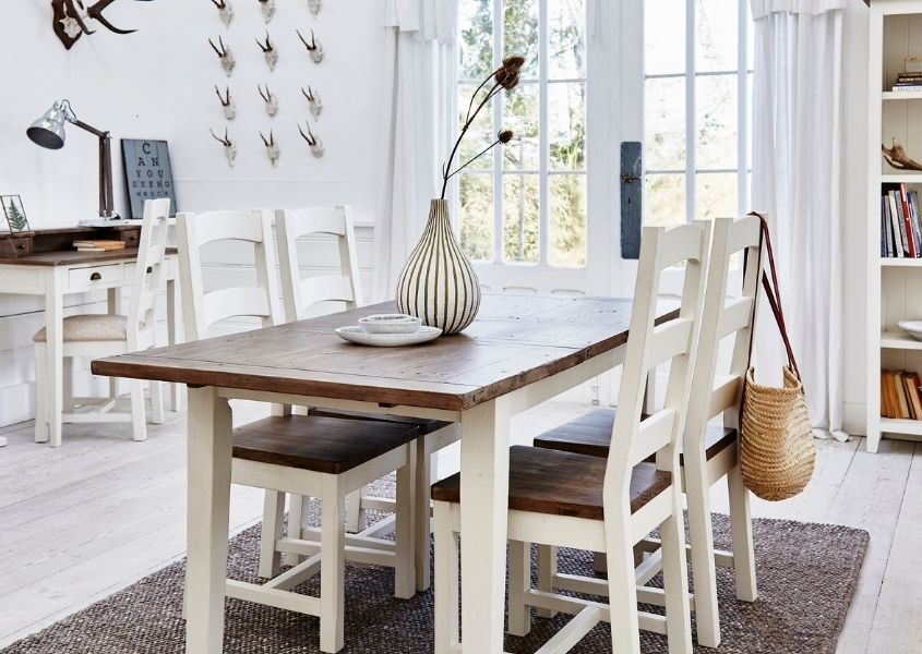 white painted reclaimed wood dining table with wooden dining chairs