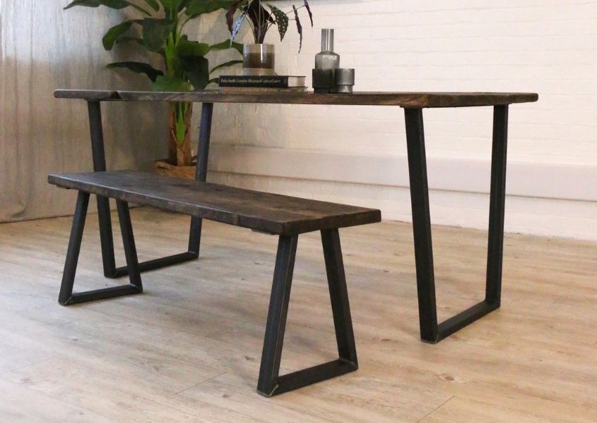 industrial dining table with v-shaped black steel legs