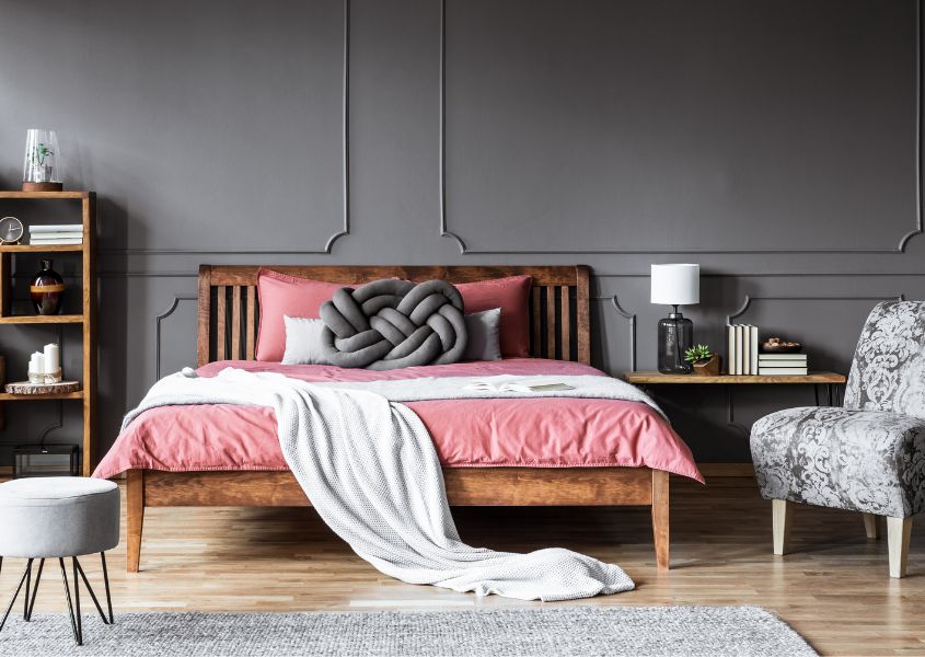 grey bedroom furniture with pink bed sheets