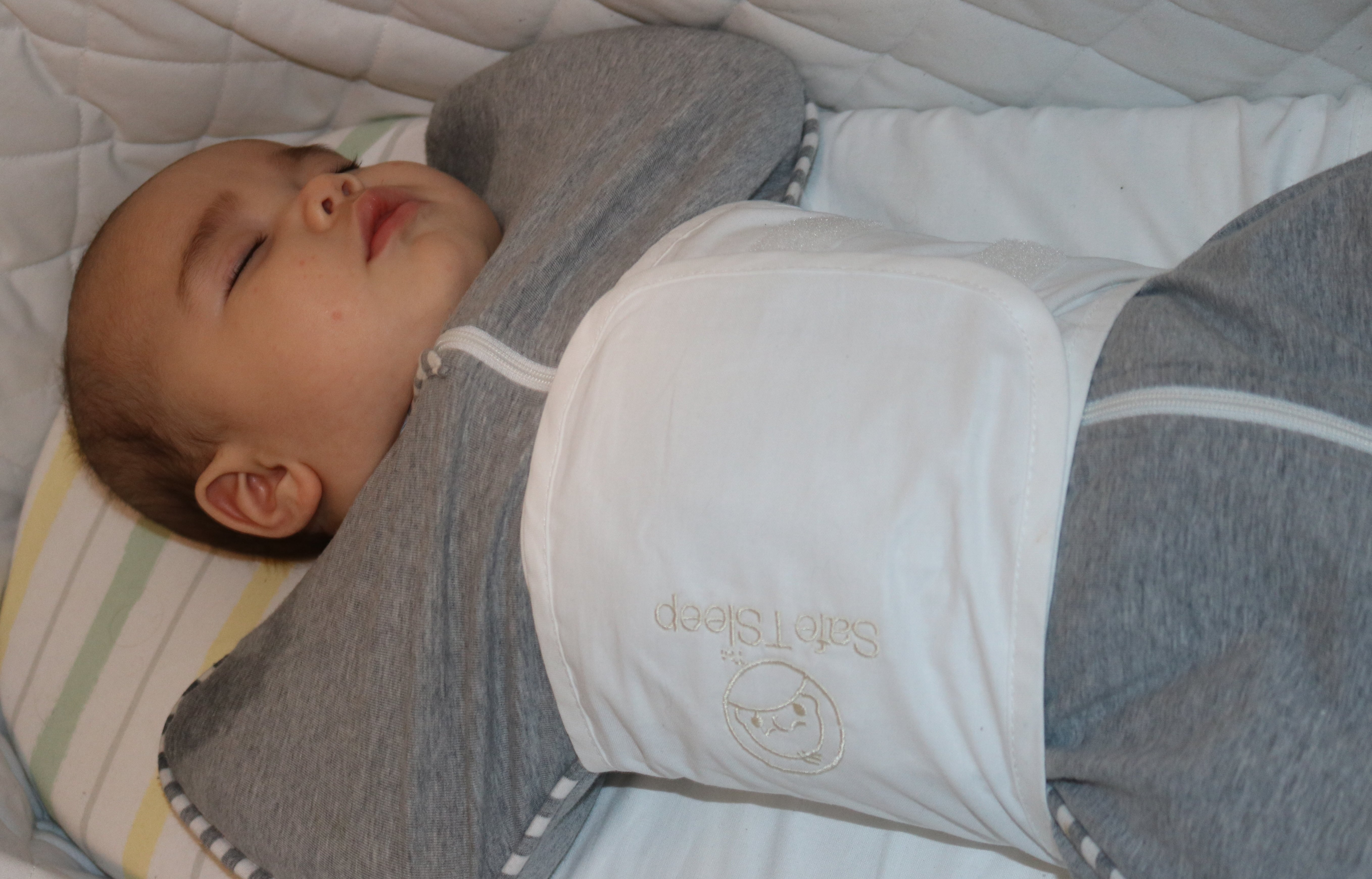 Sleepwrap baby swaddle in a bassinet