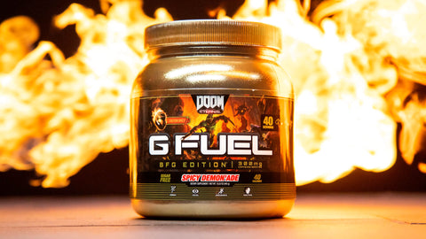 A gold G FUEL Spicy Demon'ade BFG Edition Tub with flames in the background.
