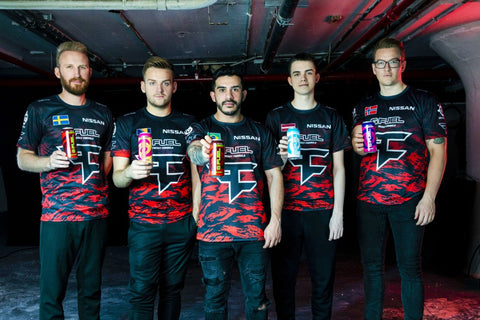 FaZe Clan members Olofmesiter, Niko, Coldzera, Broky, and Rain are holding various flavors of G FUEL Cans.