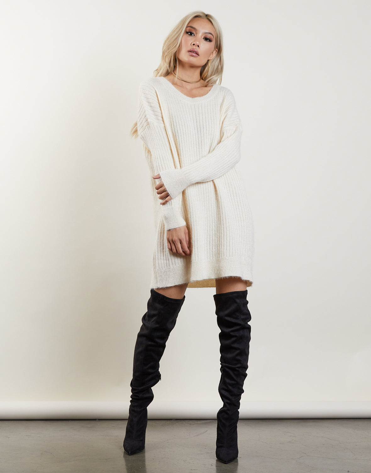 sweater and thigh high boots