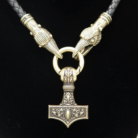 brass mjolnir necklace with two ravens' heads as clasps