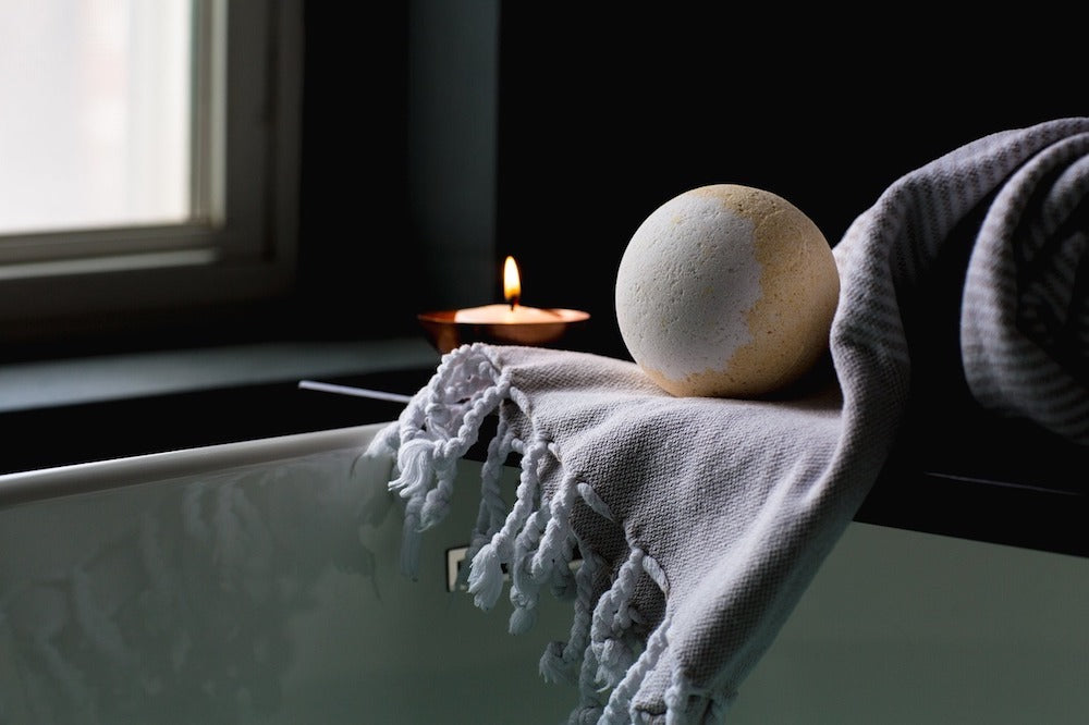 bathtub with candle LOTUSWEI flower essences