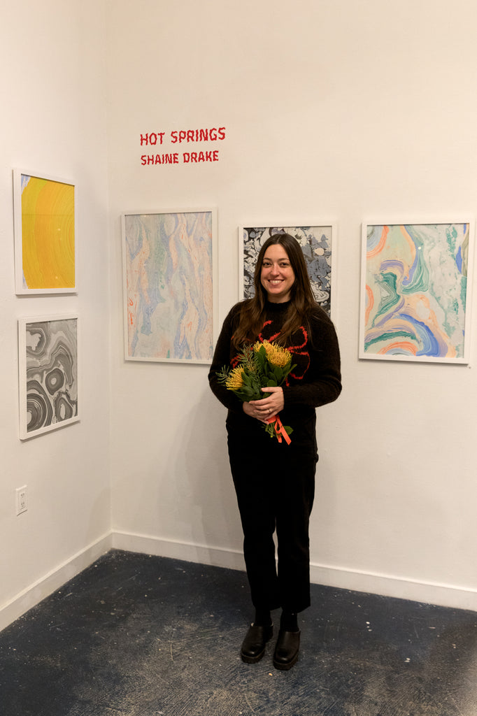 Gallery Artist Shaine Drake in front of her show Hot Springs in the Rare Device Gallery