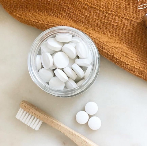 Plastic free toothbrush and toothpaste tablets.