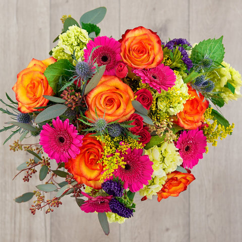 roses, gerbera daisies, hydrangeas, thistle, and eucalyptus zodiac flowers