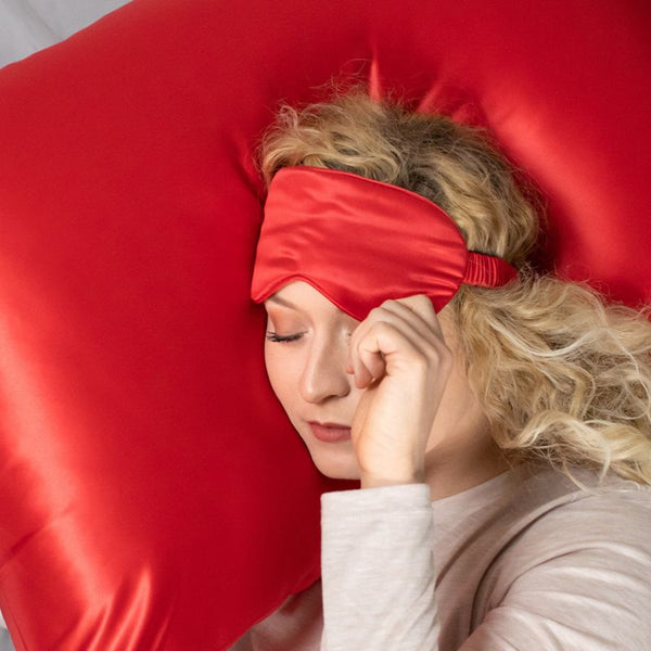 red sleep mask and pillowcase