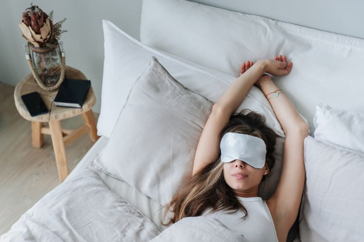woman napping with sleep mask