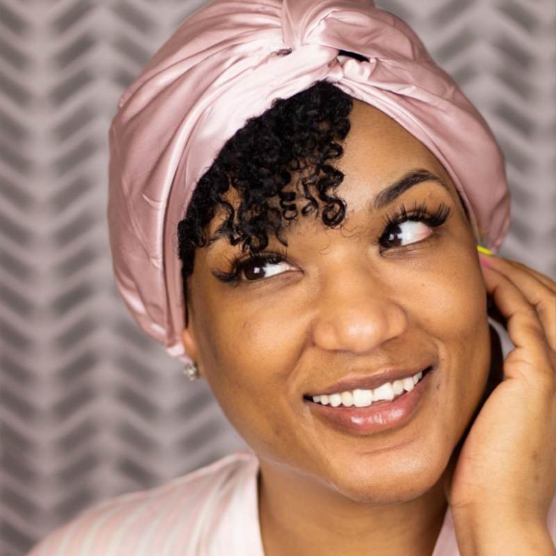 black women wearing pink sleep cap