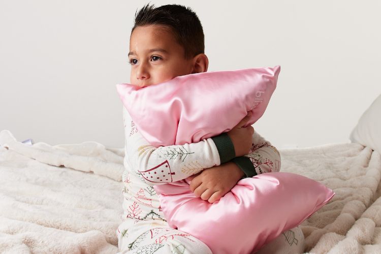 boy with blissy pillowcase