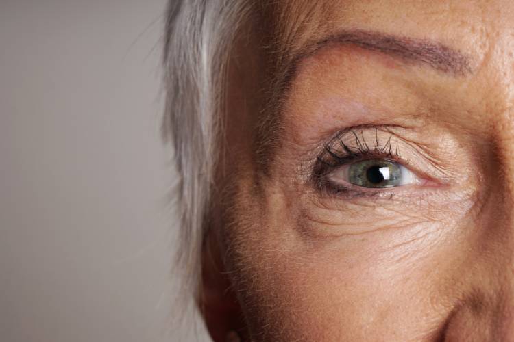 close up of woman age 70 with thinner skin
