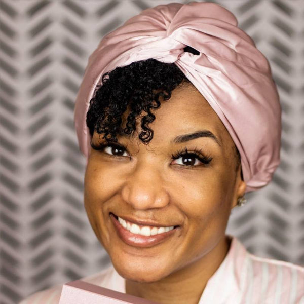 woman wearing hair bonnet on her head