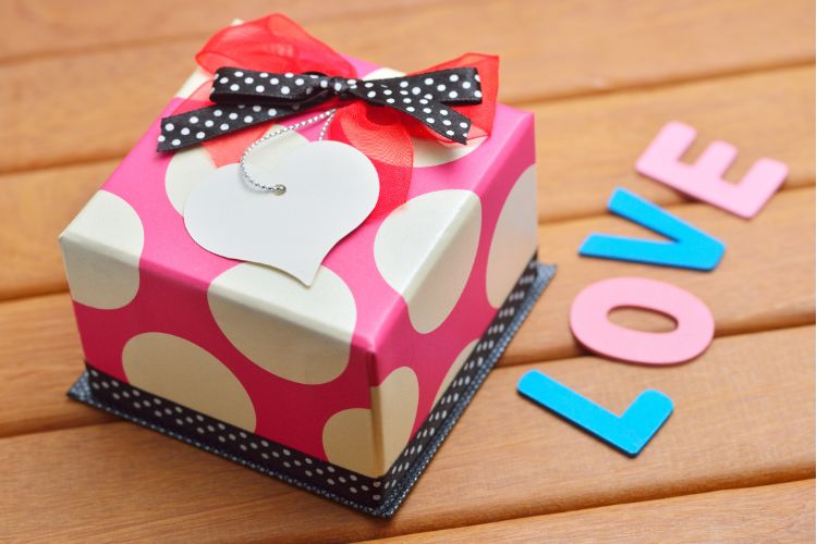 box with print gift wrap and tag