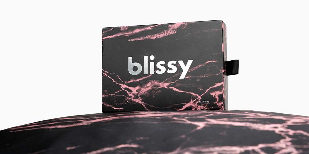 Blissy silk pillowcase in rose black marble box packaging