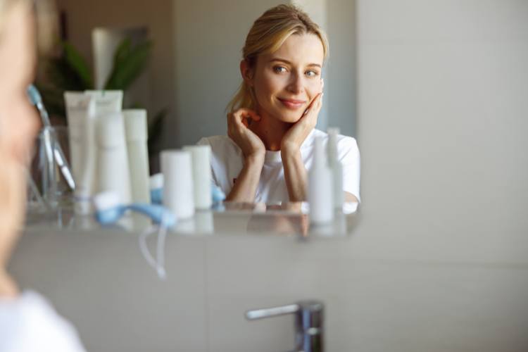 woman admiring her skin texture