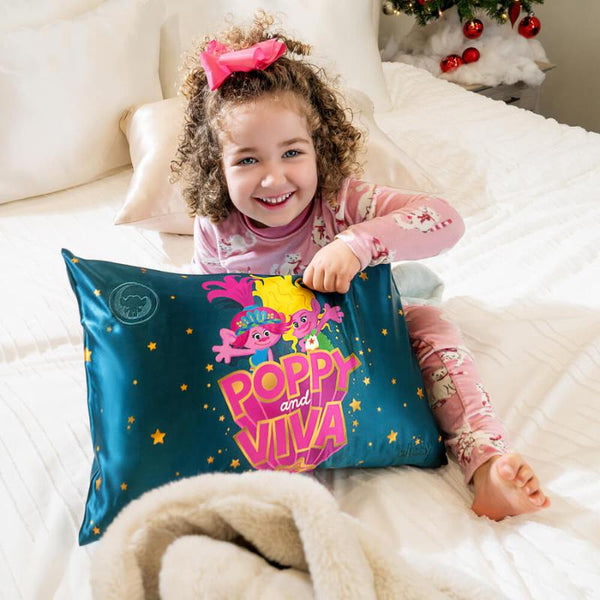 little girl with blissy trolls sister power pillowcase