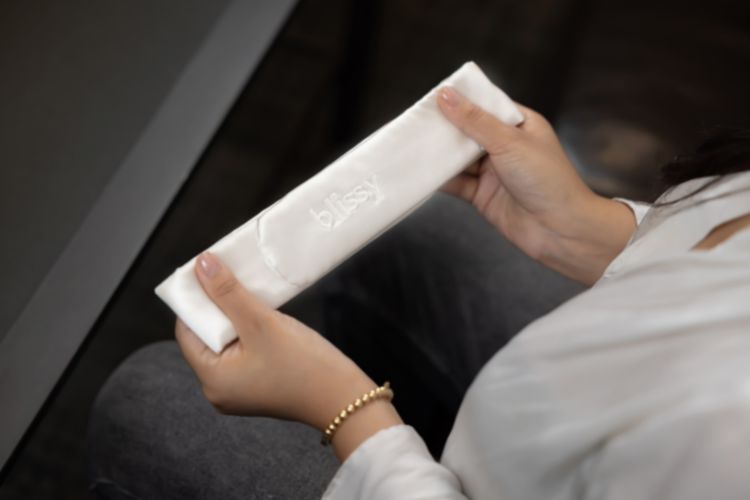 woman holding cute white functional headband