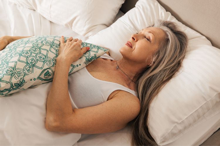 woman with a pillow nearby for extra comfort