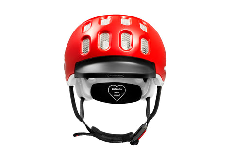 Front view of the Woom kids helmet showing rubber visor and Fidlock® magnetic closure system.