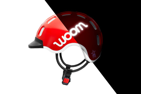 Side view of the Woom kids helmet showing the reflective logo.