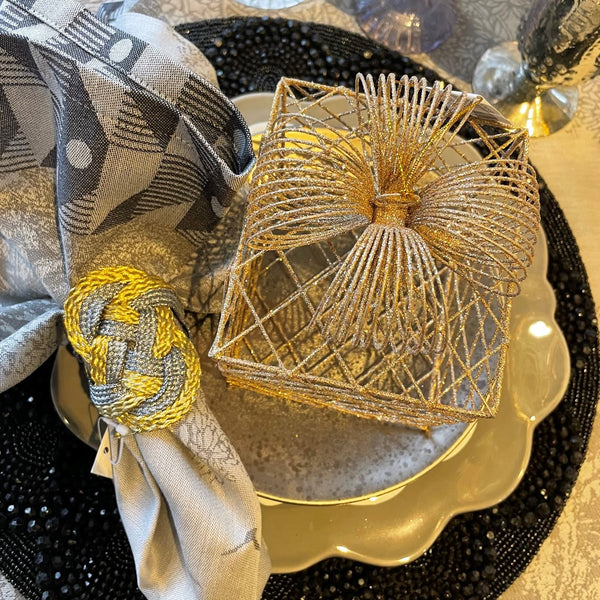 Place setting in black, gold and silver