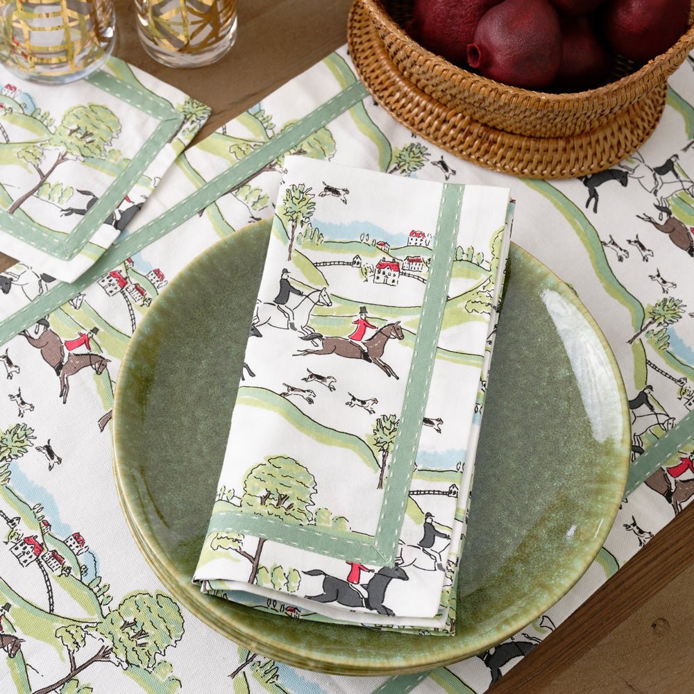 https://cdn.shopify.com/s/files/1/0224/8837/products/Web-Printed-Hunt-Scene-Green-Ribbon-Napkins_1077-398093_1600x.jpg?v=1697557169