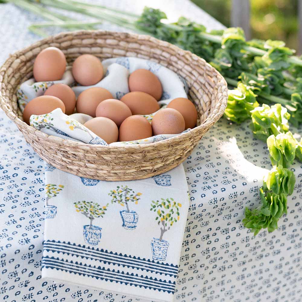 Basket of eggs with tea towels. 