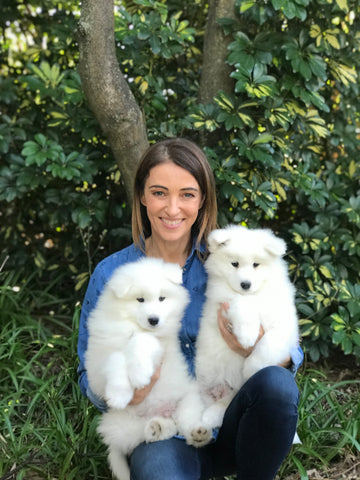 dr katrina warren smiling with white puppies