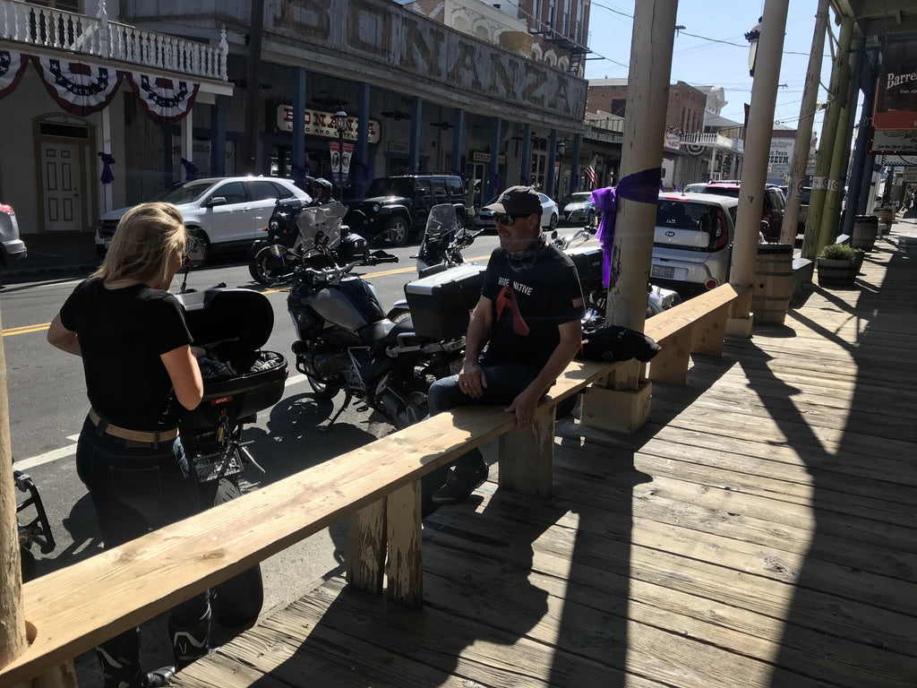 motorcyclists hanging out at Virginia City like cowboys next to their motorcycles California Nevada USA guided tour