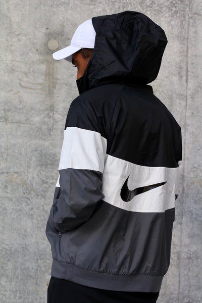 white and grey nike windbreaker